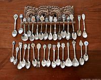 Full set of spoons displayed on rack