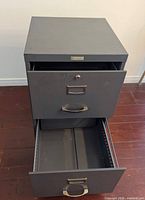 Top-down front perspective with both drawers open displaying interior rails