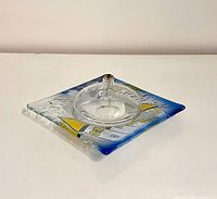 Top view showing square base artwork and central reservoir