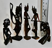 All five ebony figurines with ruler for scale