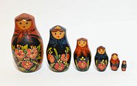 Full lineup of six nesting dolls ordered largest to smallest