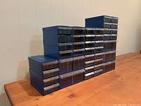 Front view of stacked blue drawer organizers