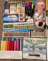 Art media including calligraphy pens, markers, pastels and coloured pencils