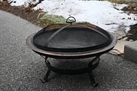 Fire pit assembled with mesh screen and stand