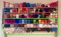 Full shelving unit with bottom three shelves highlighted; shows extent of yarn included