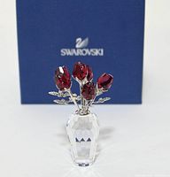 figurine front view with box in background