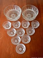 Full set arranged showing two large and ten small bowls