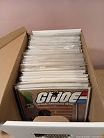 Open box showing full row of bagged/backed G.I. Joe comics