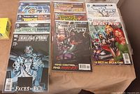 Group shot showing 11 Birds of Prey comics including Faces of Evil, Night of the Owls, Brightest Day #1–2