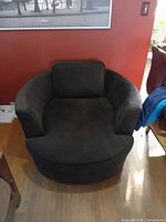 Front view of black barrel chair