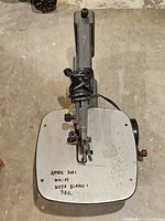 Overhead view showing entire scroll saw and note on table