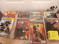 Spread of all comics showing Borderlands, Devil May Cry and multiple Gears of War issues