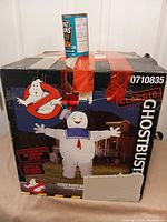 Front of original Ghostbusters box showing Stay Puft inflatable graphic
