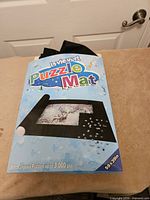 Front of retail box showing La Vievert puzzle mat, size and capacity