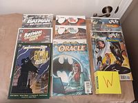 Overview of all bagged comics laid out on table