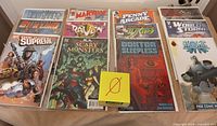 First group of bagged comics including Squadron Supreme, Raven, Scary Monsters, Penny Arcade, Worldstorm, Doktor Sleepless, Atomic Robo