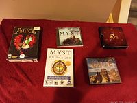 All five game packages displayed on red surface