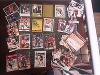 Wide view of mixed 1990s hockey cards spread on table