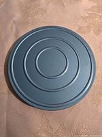 Top view of blue metal canister lid