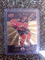 Front of Connor McDavid Tim Hortons card in top loader