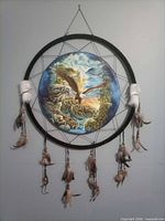 Full view of large dreamcatcher with eagle art, feathers and beads