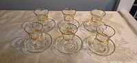 Complete set of six glasses on six saucers
