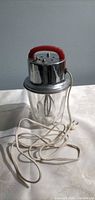 Full view of mixer assembled on glass jar with cord
