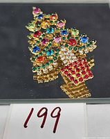Front view of multicolored rhinestone Christmas tree brooch