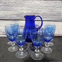 full set showing pitcher centered, eight goblets arranged around