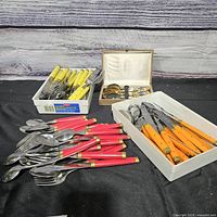 Overview of all colored handle flatware and boxed spoons