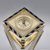 Front view showing dial, case colours and Art Deco design