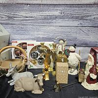 Group shot of entire lot showing figurines, ornaments, brass items, basket