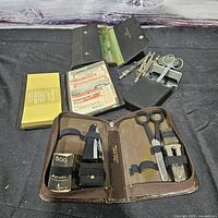 overview of all cases open showing drafting set, grooming set and loose tools