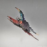 Front view showing abstract shape and iridescent finish