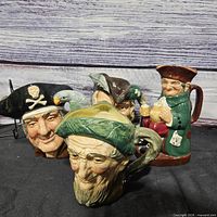 Four Royal Doulton character jugs grouped