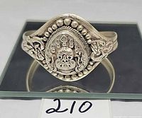 Front view showing Mahakala face and bead border