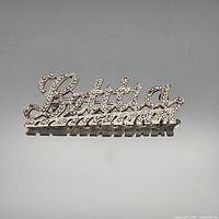 Front view of brooch showing Bettina script and marcasite stones