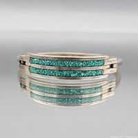 Front view of sterling silver bracelet showing turquoise inlay