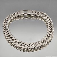 Full view of sterling silver curb chain bracelet clasped