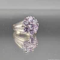 Three-quarter view of sterling silver ring with lavender gemstone cluster