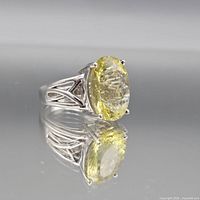 Front and side view of ring showing gemstone, setting and design