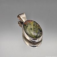 Front view of pendant showing stone and bezel