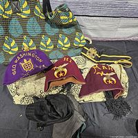 All items together: fez, two side caps, tote, cloth bag, gloves