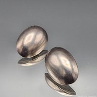 Front view of both oval domed sterling silver earrings