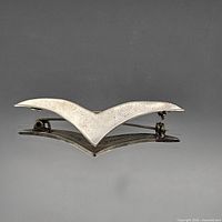 Front view of V-shaped sterling silver brooch