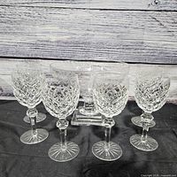 Group view of five diamond-cut wine glasses and pedestal compote