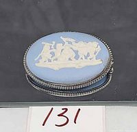 Front view of oval blue jasperware cherub brooch