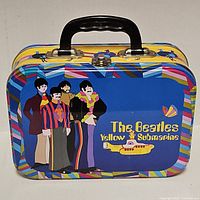 Front view showing Beatles Yellow Submarine artwork, handle and clasp