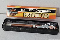 Pen in open display box with outer branded sleeve