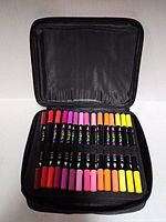 Open case showing two rows of colored markers
